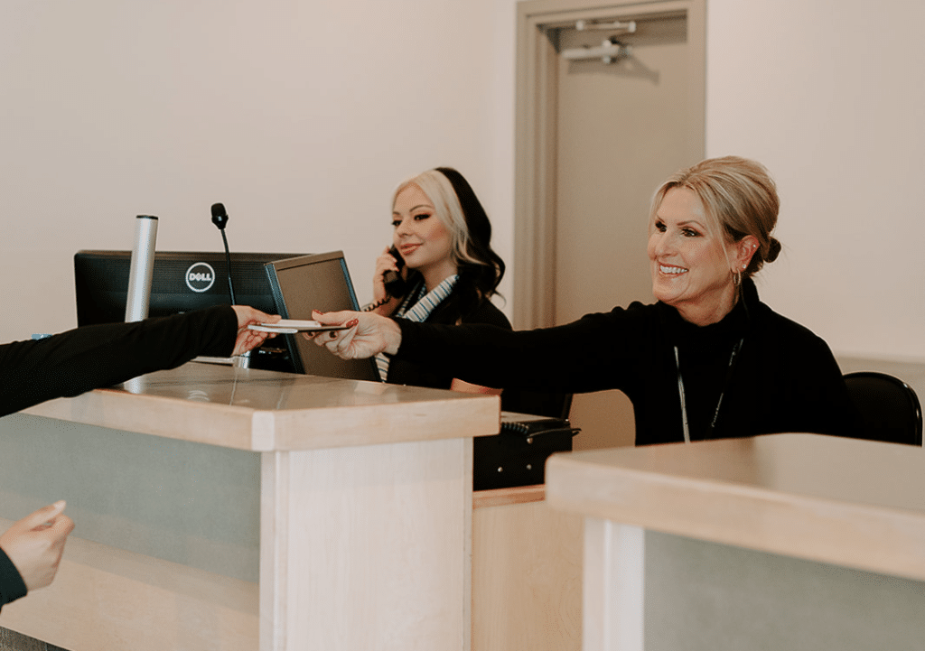 Airport customer service agent providing travel assistance, showcasing passenger-facing careers in aviation