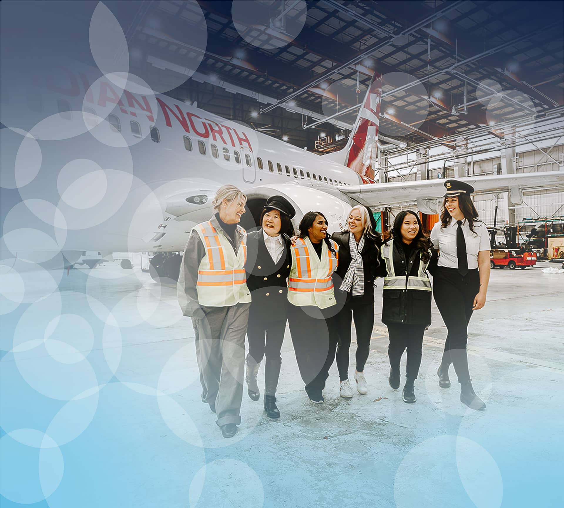 Elevate your aviation career path. Diverse group of women working in aviation stand together at Elevate Aviation Learning Center.